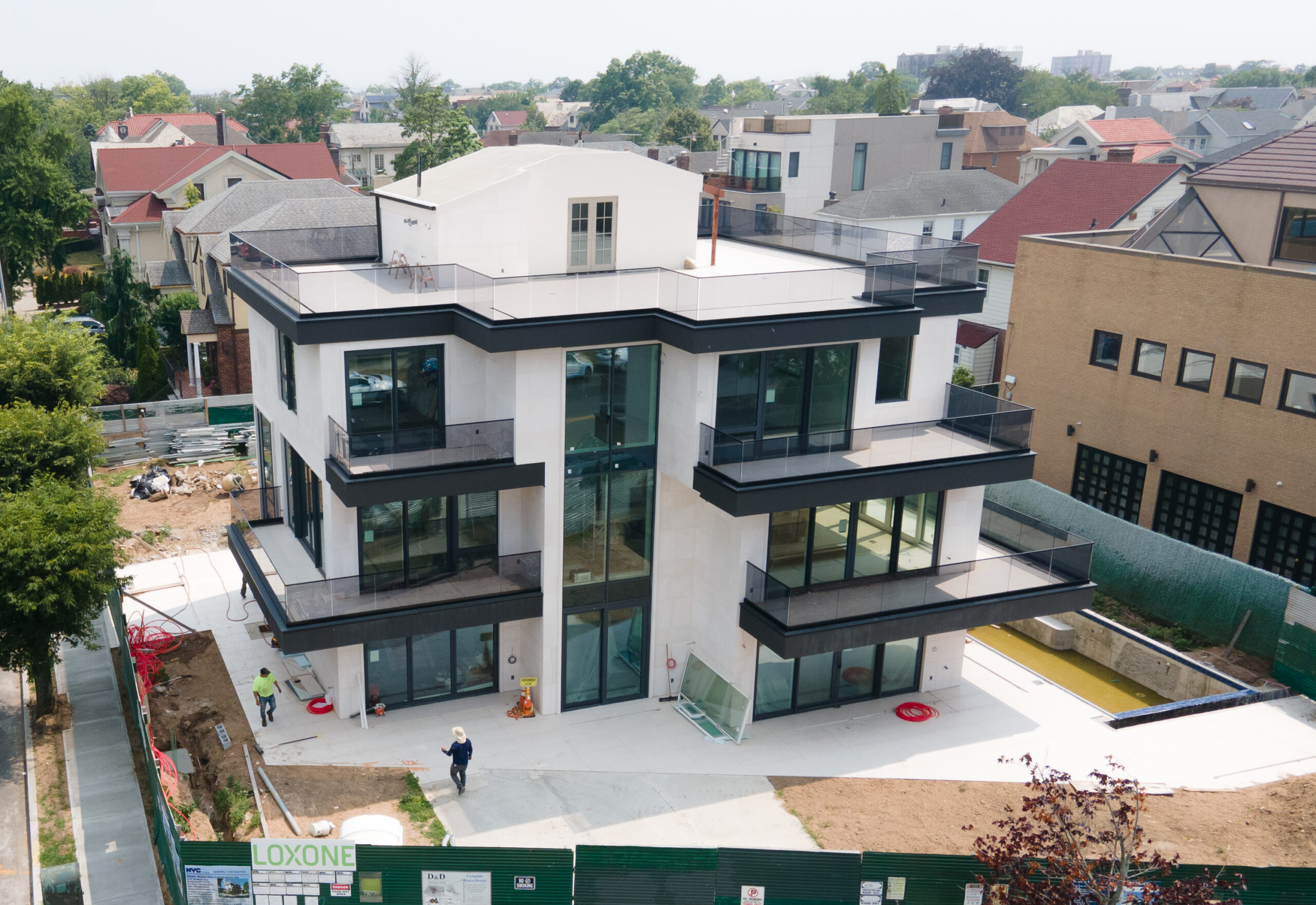 Avrams aluminum windows and sliding doors on a modern private oceanfront home in Brooklyn with railings